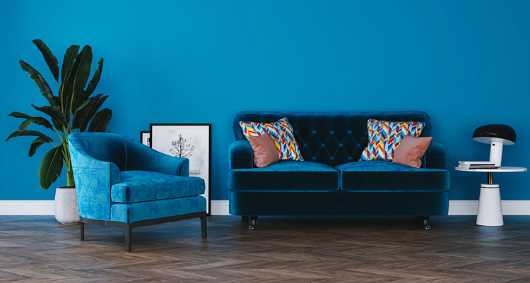 fotel oraz sofa w odcieniach błękitu w salonie 